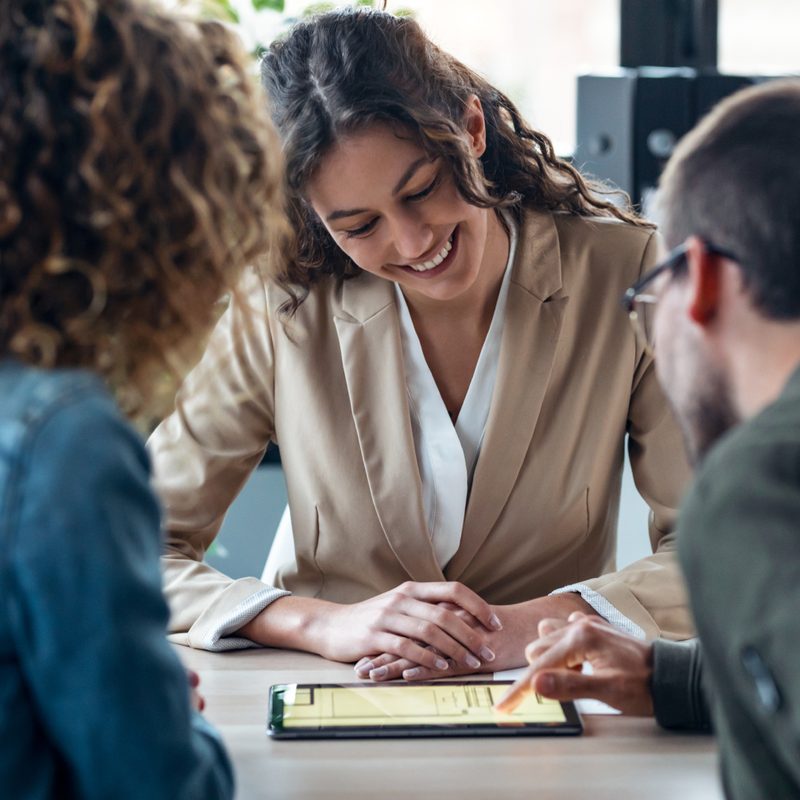 Homebuyers reviewing loan documents on a tablet